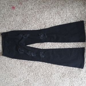 Ripped flared black high rise jeans